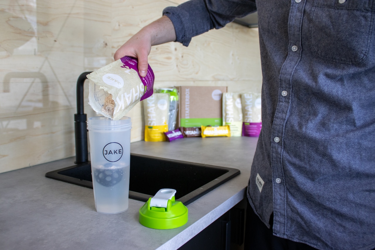 Man pouring a shake into shaker